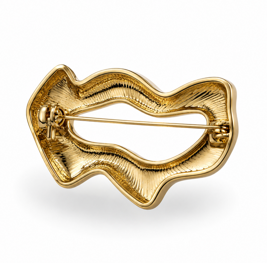 Broche Lía dorado y plateado.
